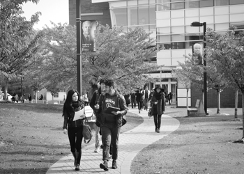 Students walking down path on campus