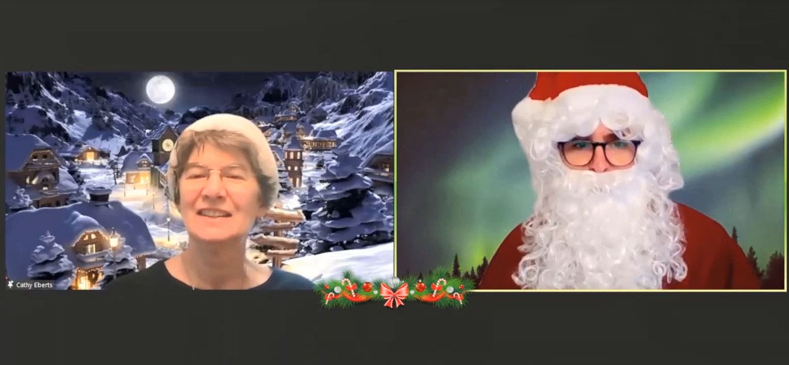 a screenshot of Cathy Eberts speaking with Santa
